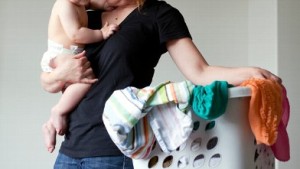 Mom with baby doing chores busy